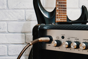 Guitar amp with plugged in cable
