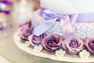 wedding cake with violet  flowers