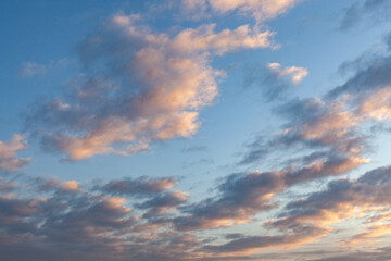 Naklejka na ściany i meble Cloudy sky at sunrise