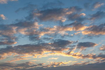Naklejka na ściany i meble Cloudy sky at sunrise
