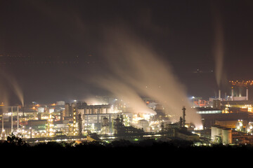 Fototapeta na wymiar Bright smoking factory in the evening top view. Kazincbarcika, Hungary.