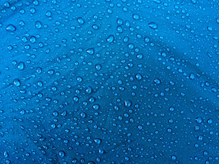 Water drops on waterproof membrane fabric. Morning dew on tent.