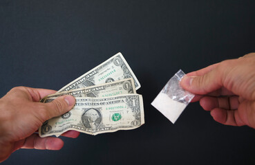 Money and cocaine. Addiction. Drug's use. Dollars in hand.