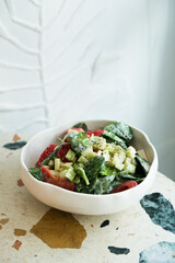 Healthy vegetable salad with yogurt dressing
