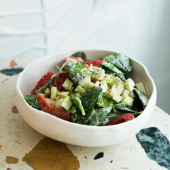 Healthy vegetable salad with yogurt dressing