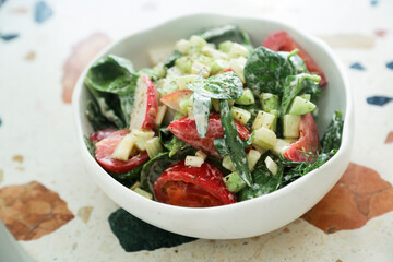Healthy vegetable salad with yogurt dressing