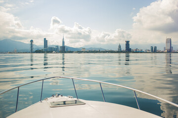 View on Batumi from a yacht. Batumi panorama. Marine town.
