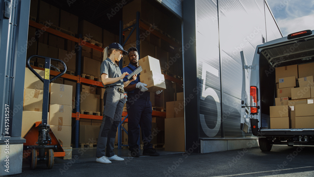 Wall mural outside of logistics distributions warehouse with manager using tablet computer, diverse workers loa