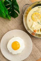 Sayur lodeh  is an Indonesian vegetable soup prepared from vegetables in coconut milk popular in Indonesia. The origin of the dish can be traced to the Javanese people's tradition of Java.