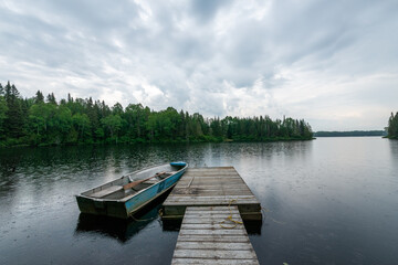 dock on peaceful lake in the morning -