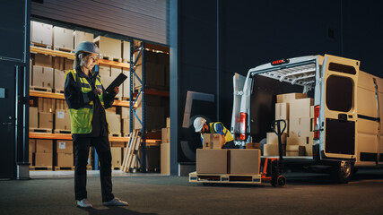 Portrait of Beautiful White Woman Worker Using Tablet Computer in Warehouse full Cardboard Boxes. In Background Professional Loading Cardboard boxes,  e-Commerce Online Orders into Truck.