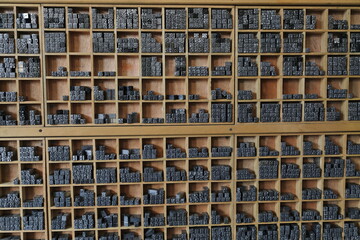 Lead pieces for traditional printing on wooden shelves. Shuyuanmen Street-Xi'an-China-1564