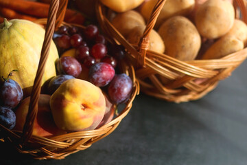 Various seasonal fruit and vegetable on dark background. Selective focus.