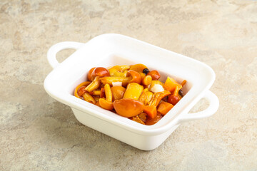 Marinated pickled honey mushrooms in the bowl