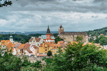 Fototapeta na wymiar Panoramic view of famous medieval town of Loket,Elbogen, with colorful houses and stone castle above river,Czech Republic.Historical city centre is national monument.Travel architecture background