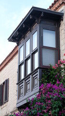 Fototapeta na wymiar village house with brown balcony