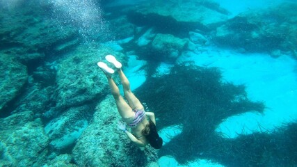 young woman snorkeling in Menorca