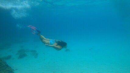 Fototapeta na wymiar young woman snorkeling in Menorca