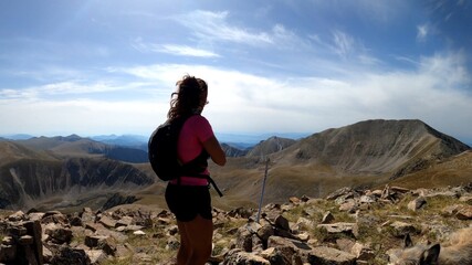 Fototapeta premium young woman hiking in the mountains