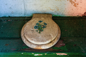 An old outhouse with a toilet seat