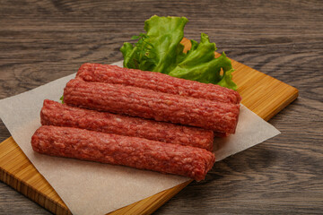Raw beef sausages with spices