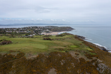 The huge surfing beach of Caswell Bay, on the South Wales Coast Path, at low tide