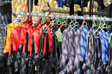 Aquatic rescue vests in coat rack for aquatic activities
