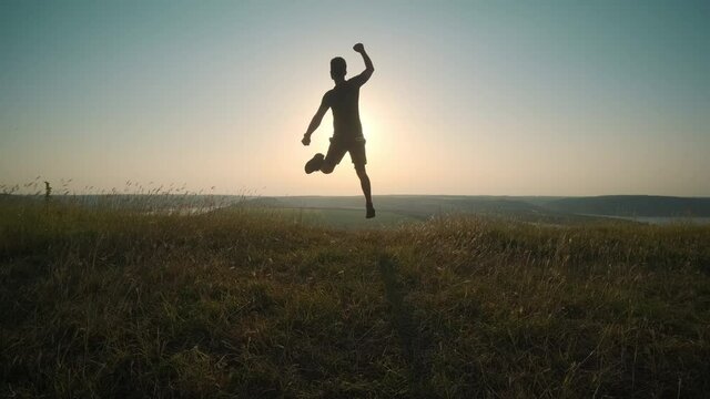 The handsome man running on scenic river background. slow motion