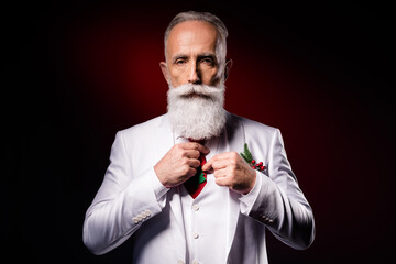 Photo of mature man serious concentrated fix tie prepare showman event isolated over dark color background