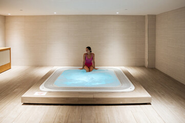 Woman in hot tub in spa