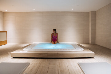 Woman in hot tub in spa
