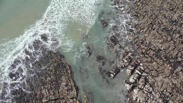 The huge surfing beach of Caswell Bay, on the South Wales Coast Path, at low tide