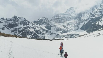 Trekking tourists, highland expedition to foot of stunning snowy Annapurna III mountain, Nepal