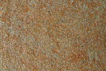 structure of a yellow stone with shiny blotches.