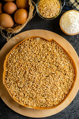 Kue Hok Lo Pan or martabak bangka. The martabak bangka batter is made from a mixture of flour, eggs, sugar, baking soda, coconut milk and water.The batter is cooked upon a thick round iron frying pan 