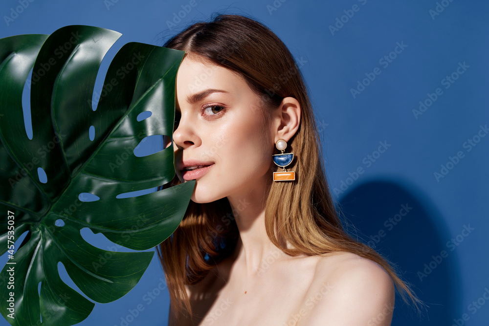 Sticker beautiful woman green palm leaf posing blue background