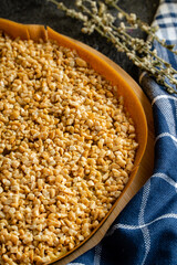 Kue Hok Lo Pan or martabak bangka. The martabak bangka batter is made from a mixture of flour, eggs, sugar, baking soda, coconut milk and water.The batter is cooked upon a thick round iron frying pan 