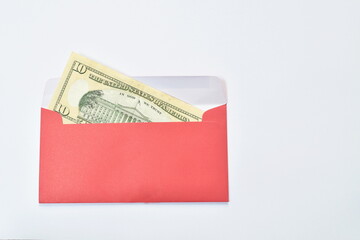 red envelope for reward youth in Chinese new year festival with ten US dollar on white background