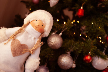 doll, girl in a fur coat and hat, snow maiden, Christmas decor, toys, bows, glass balls, bokeh, background, toys, merry christmas, happy new year. Lights, sparkles and highlights, snow, Christmas tree