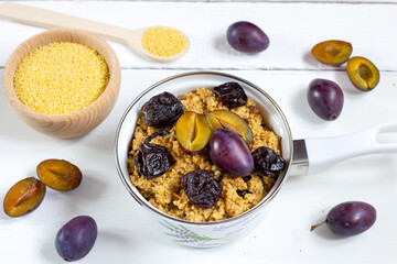 Millet with plums. A warm autumn breakfast