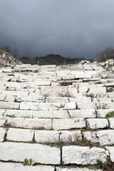 ruined white marble staircase on the main street of abandoned ancient city Sagalassos lost in Turkey mountains