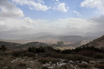 scenic view from the top of mountain tothe valley under cloudy sky