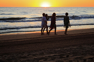 Fototapeta na wymiar A golden summer sunrise on the beach