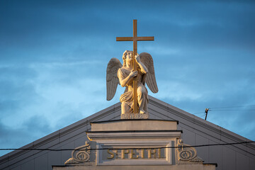 Fototapeta na wymiar Angel at the Roof of Church of St. Paul and St. Petr , Saint Petersbur, Russia