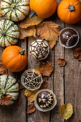 Funny Halloween cakes for party. Halloween background with pumpkin and cake. Autumn, Halloween, party concept. Copy space