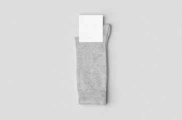 Light grey socks mockup with blank label.