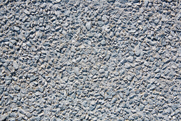 Gravel and concrete pavement used for pedestrian areas, cement works as a fixative and gravel...