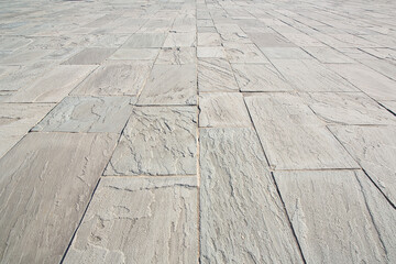 New paving made with gray split stone blocks of rectangular shap