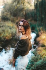 autumn photo session of a beautiful girl with dark hair in the forest.