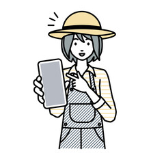 立ってスマートフォンを指差してこちらに向けて見せている農家の女性